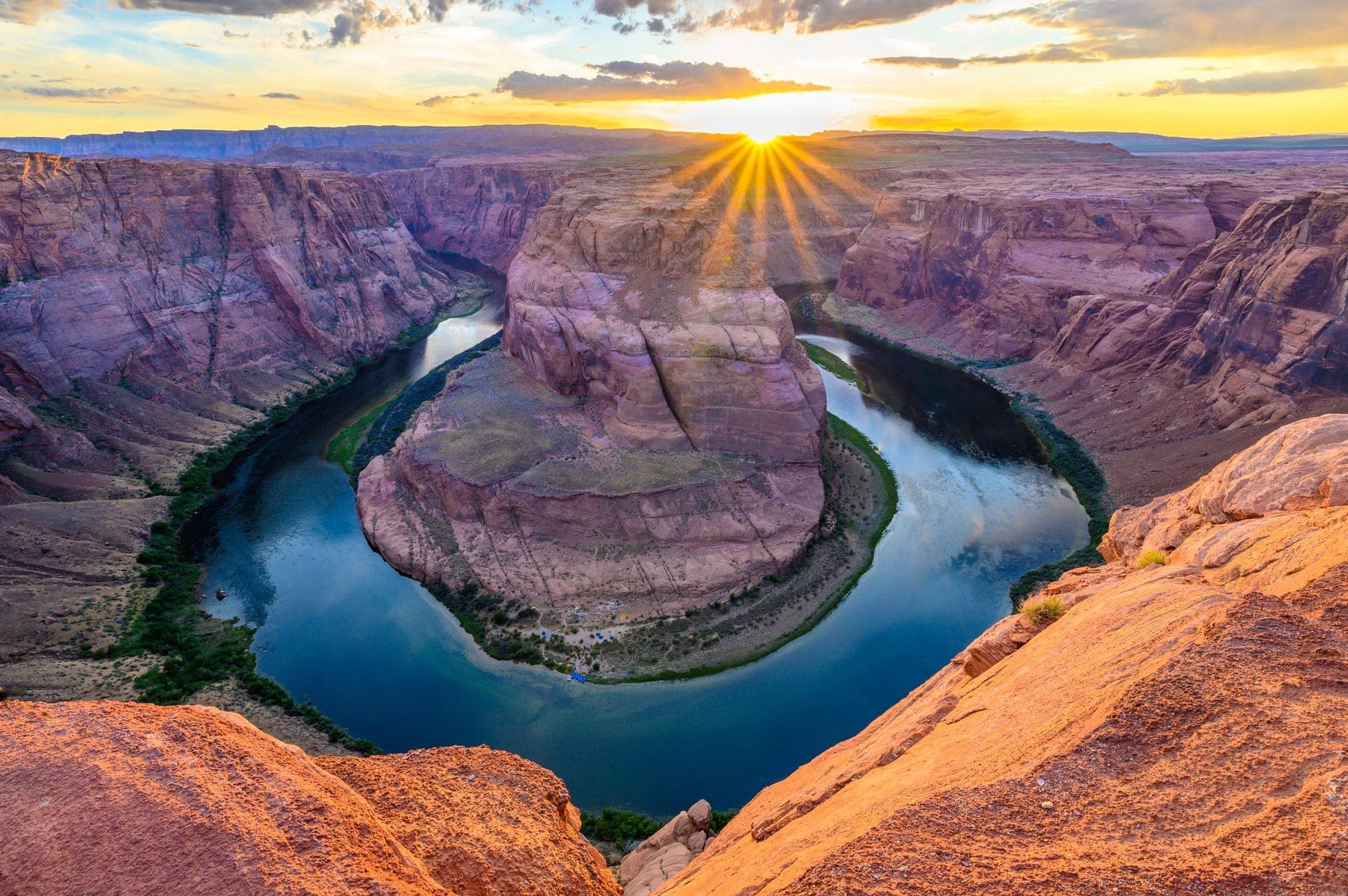 The Colorado River curving around the red sandstone of Horseshoe Bend from above, a landscape by Carlton Soohoo